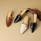 "Marloe Spitz zulaufende Leder-Mules" can be rewritten as "Marloe Elegante Spitz zulaufende Leder-Mules".