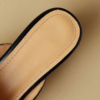 "Marloe Spitz zulaufende Leder-Mules" can be rewritten as "Marloe Elegante Spitz zulaufende Leder-Mules".