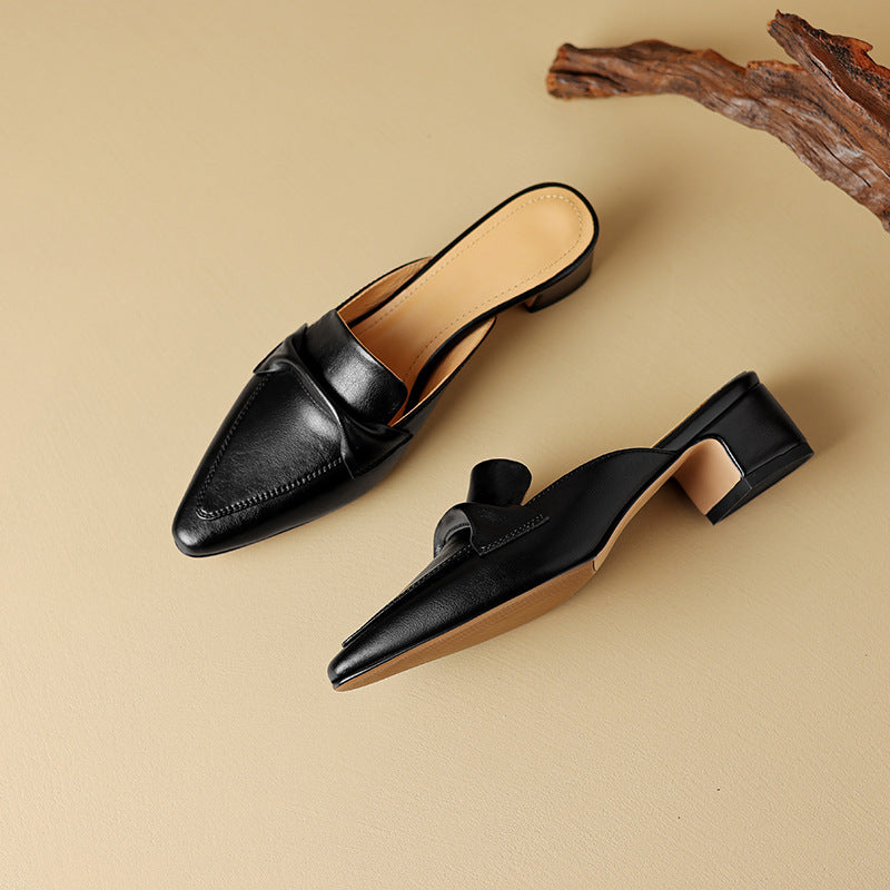 "Marloe Spitz zulaufende Leder-Mules" can be rewritten as "Marloe Elegante Spitz zulaufende Leder-Mules".