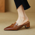 "Marloe Spitz zulaufende Leder-Mules" can be rewritten as "Marloe Elegante Spitz zulaufende Leder-Mules".